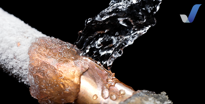 Water bursting out of a frozen copper water pipe