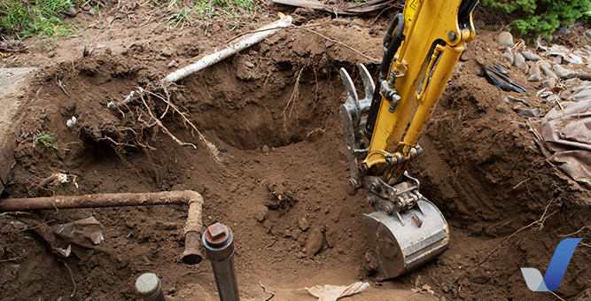 Backhoe Replacing an Inground Fuel Storage Tank