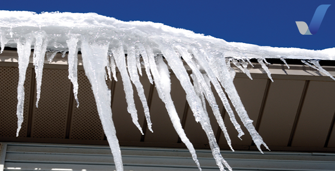 Ice dam beginning to form on the roof of a house